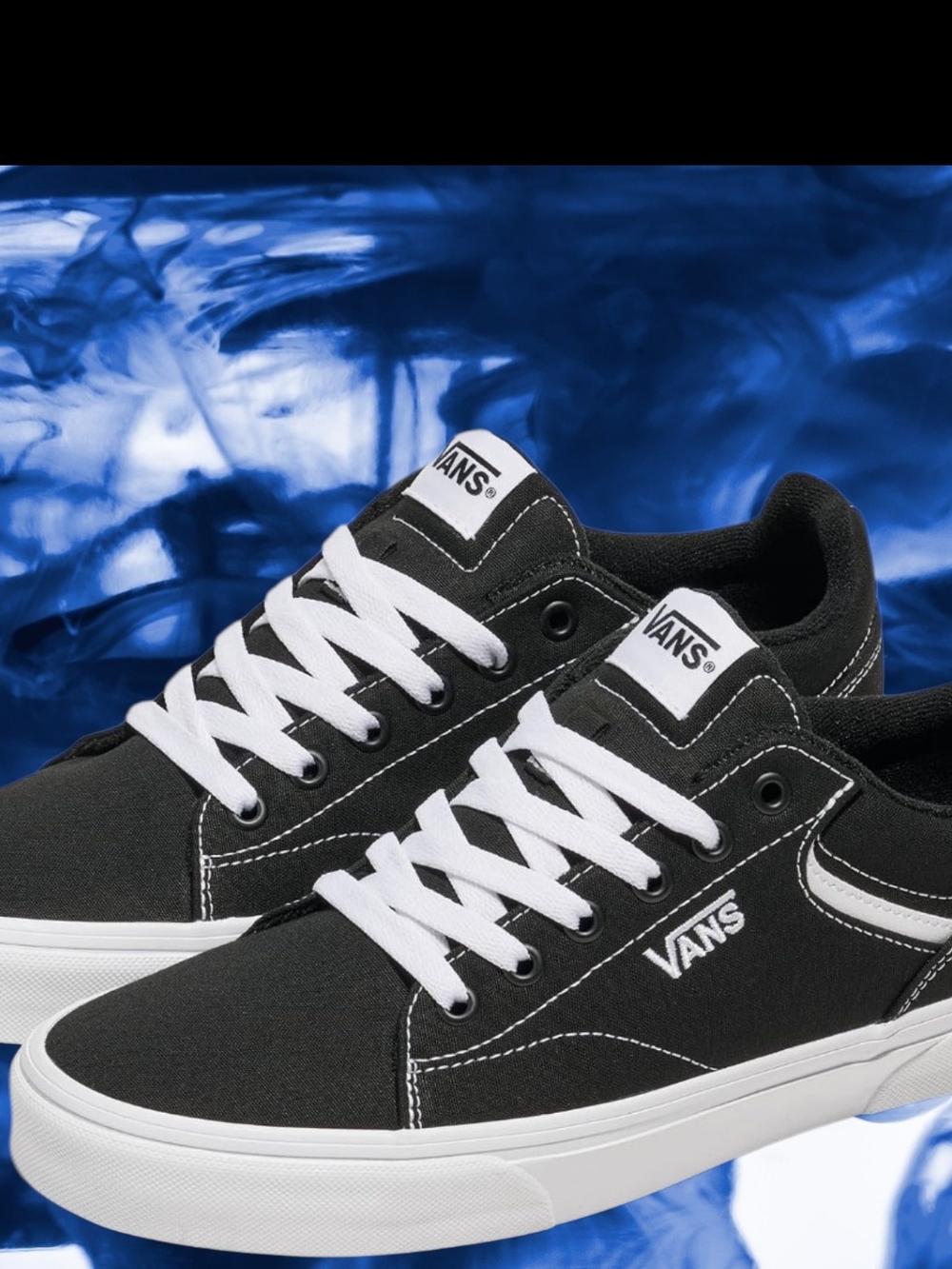 Vans Black and White Low-Top Canvas Sneakers